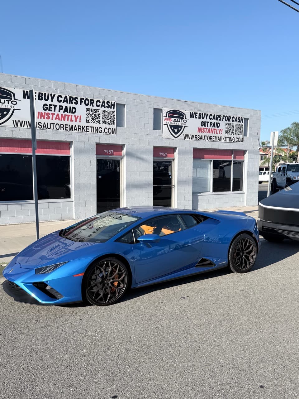 Blue Lamborghini Huracán outside RS Auto Remarketing